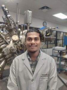 Profile photo of Reaz Munna in front of the MBE systems